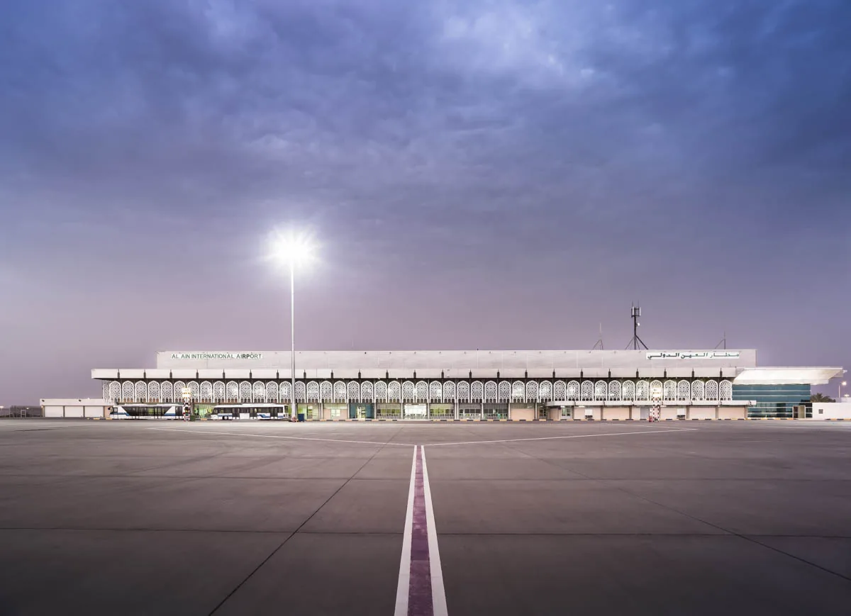 Al Ain International Airport terminal at dusk