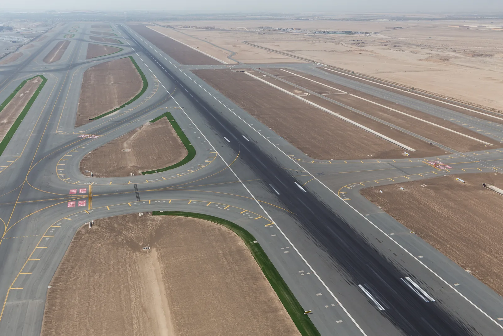 Aerial view of airfield runways and taxiways at Abu Dhabi International Airport