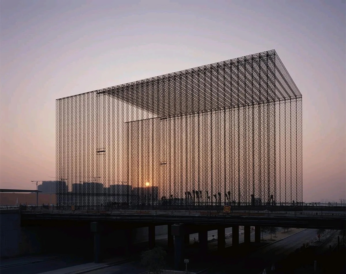 A latticed structure at the Expo 2020 Dubai site at dusk