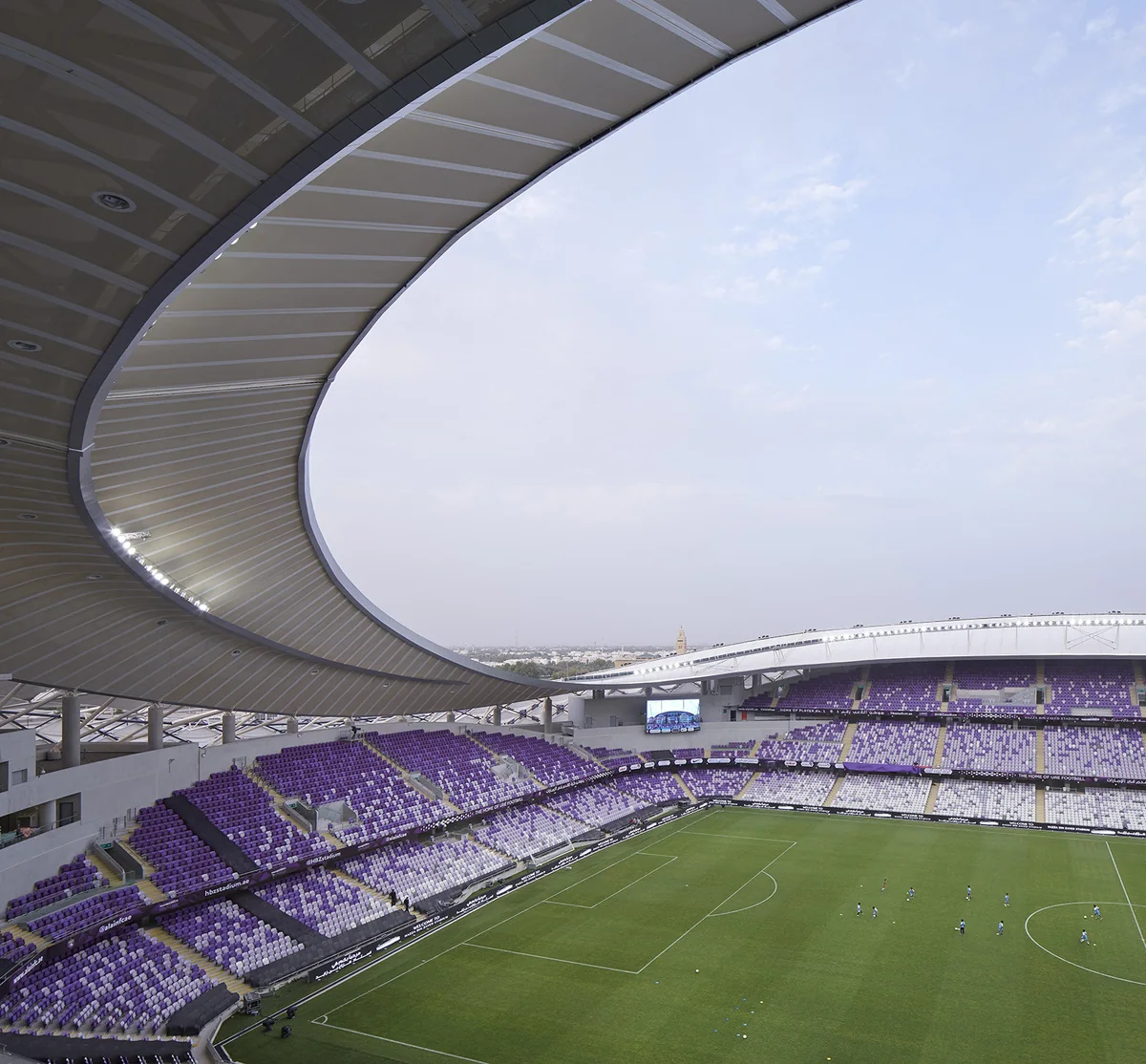 Interior of Hazza Bin Zayed Stadium showing the stands, pitch and roof