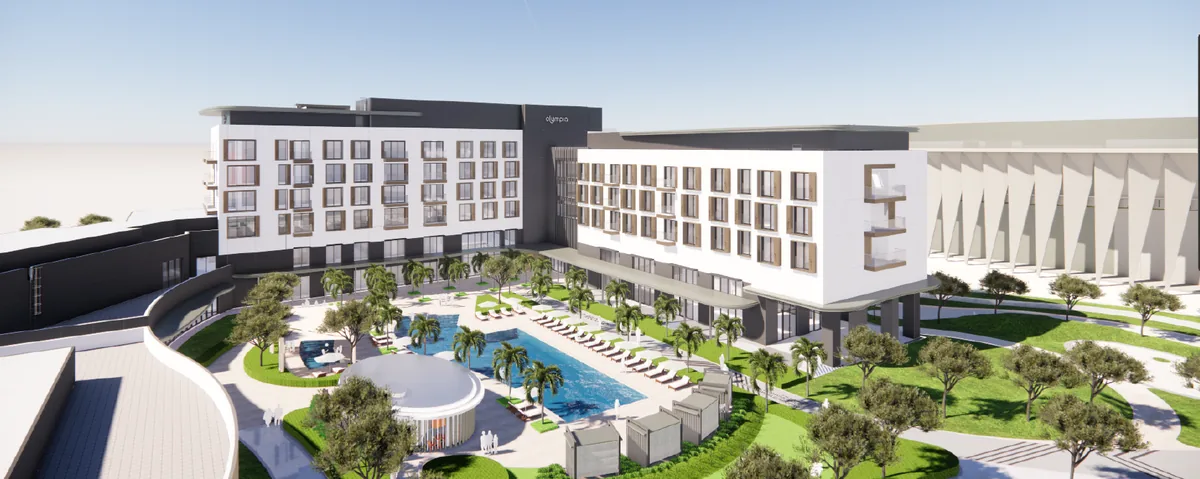 Pool and landscaped grounds of the sports hotel within the development