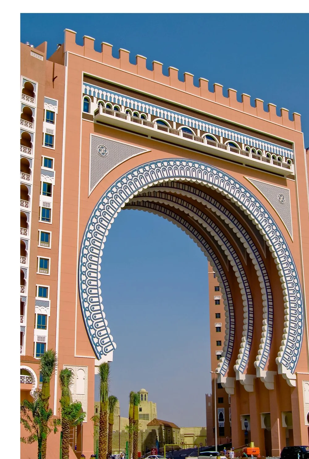 The decorated Moorish archway of Ibn Battuta Gate against a clear sky