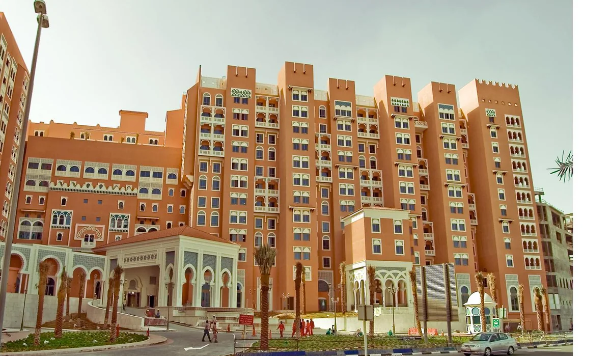 Street-level view of the Ibn Battuta Gate residential facades and entrance